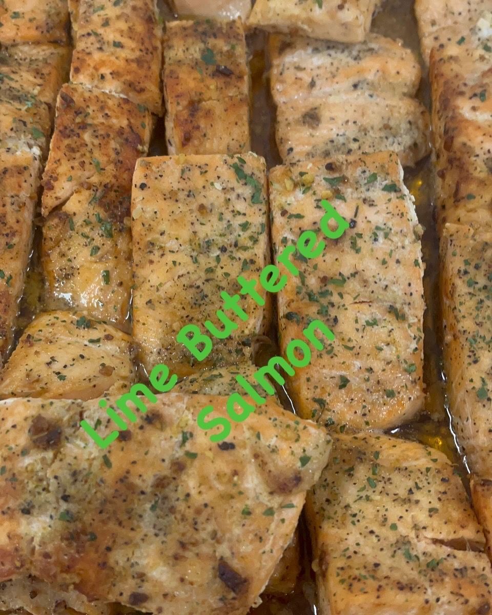 Lime buttered salmon fillets, seasoned and cooked, close-up.