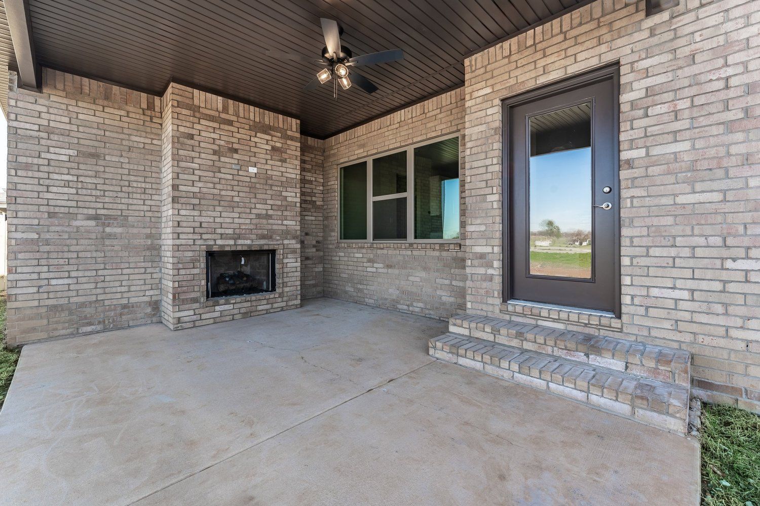 Deck Backyard Concrete Brick Entertainment Area House Home New Vision Real Estate NWA Arkansas