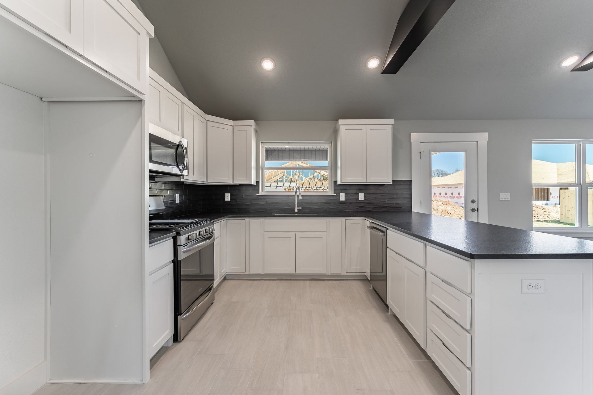 Kitchen Black Countertop Backsplash House Home New Vision Real Estate NWA Arkansas