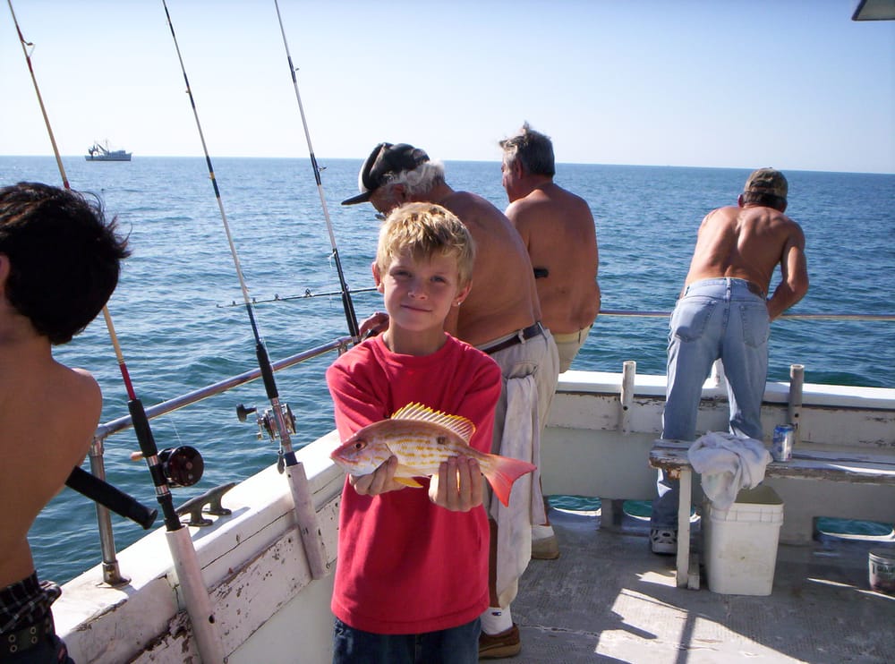 A child on a deep-sea fishing charter near Cape Coral, FL