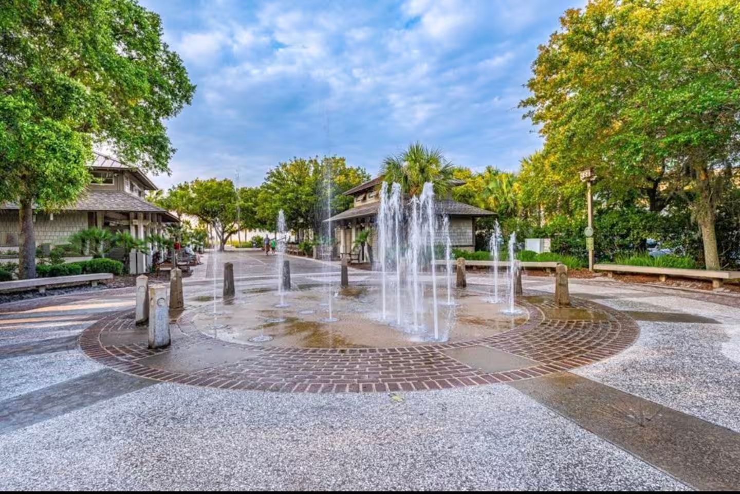 Coligny Beach fountain in the middle of the park surrounded by trees.