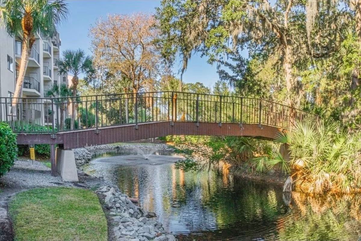 Take a stroll over this bridge for scenic photos of the villa's pond.
