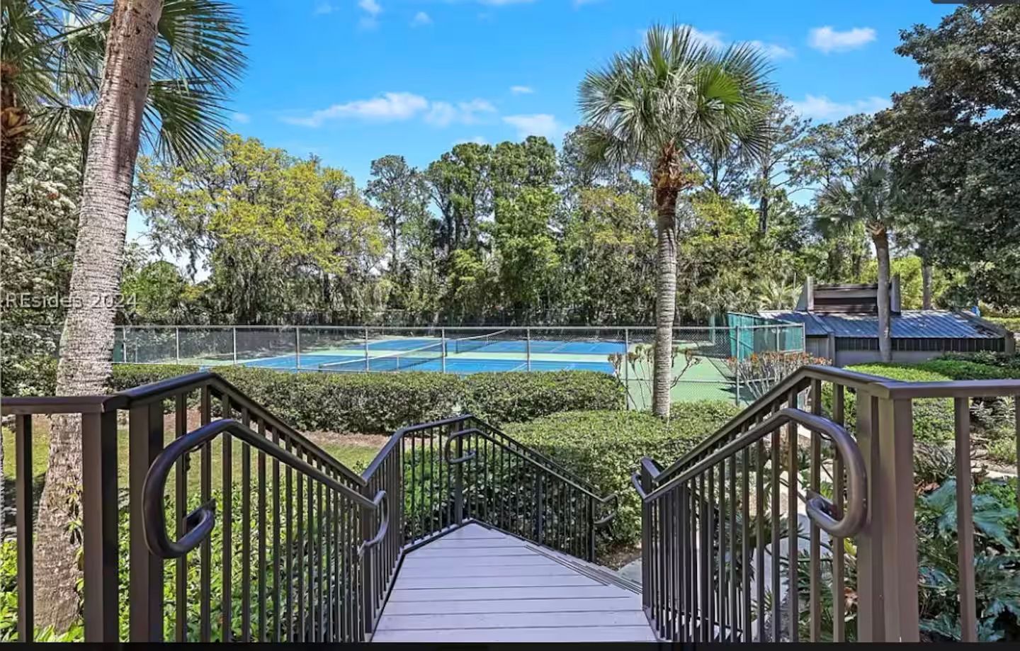 A view of the tennis and pickleball courts from the entrance to your vacation rental.