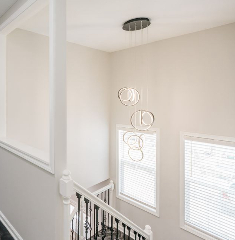 A view of a staircase from the second floor of a house.