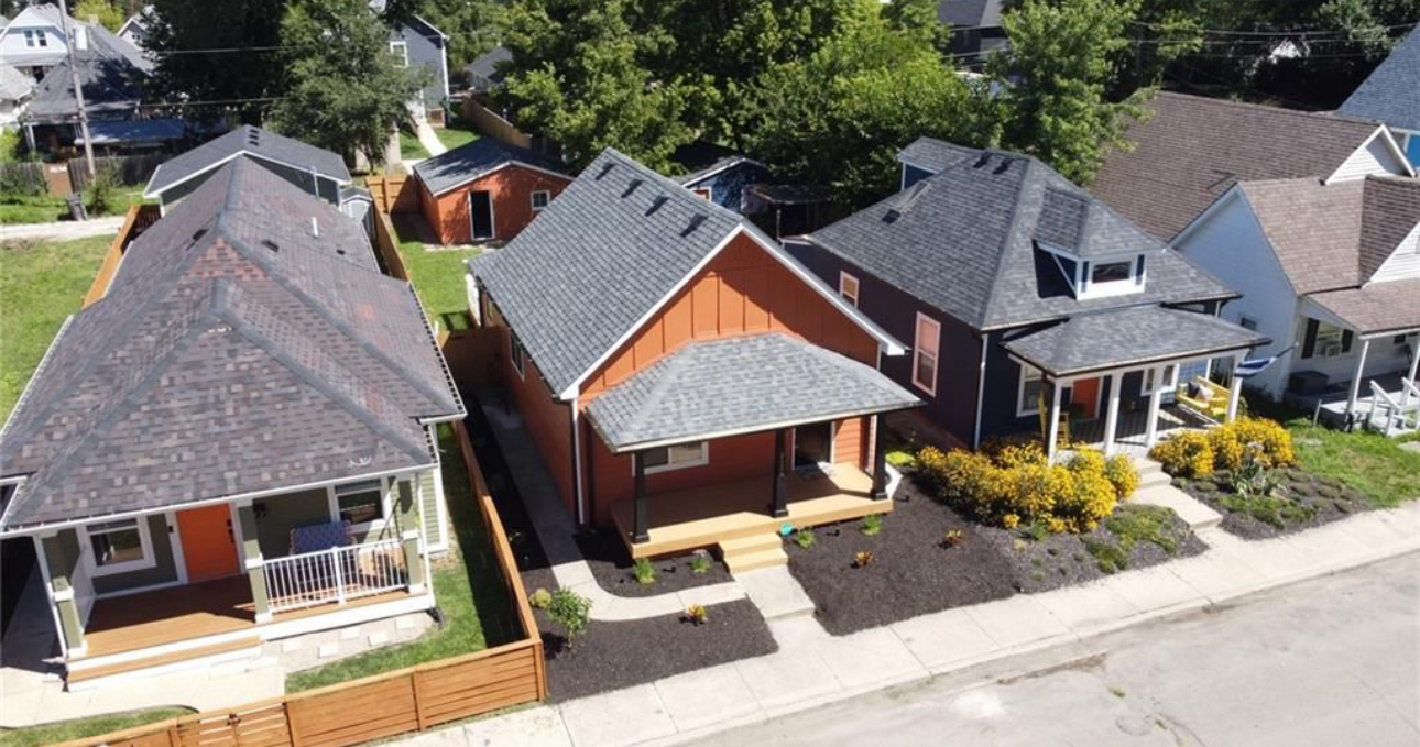 An aerial view of a row of houses in a residential neighborhood.