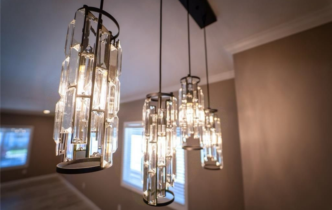 A room with a lot of lights hanging from the ceiling