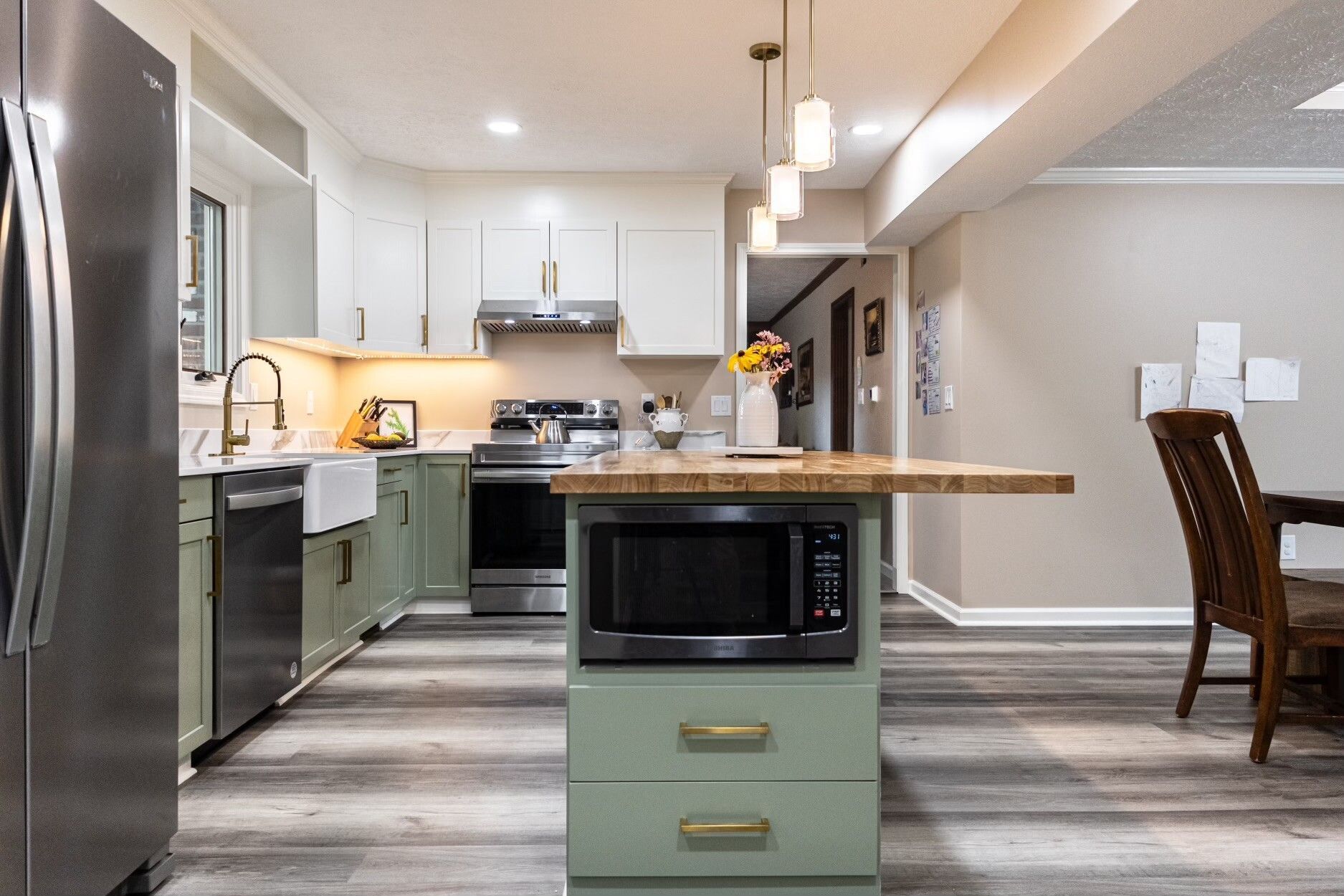 remodeled kitchen island with inset microwave and drawers