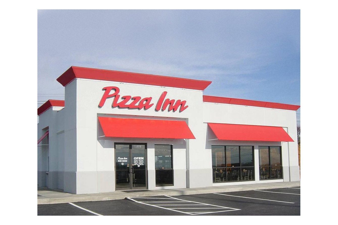 A pizza inn restaurant with a red awning