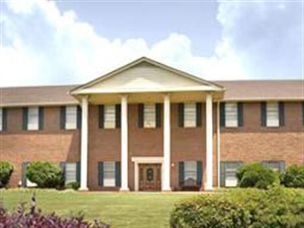A large brick building with columns in front of it