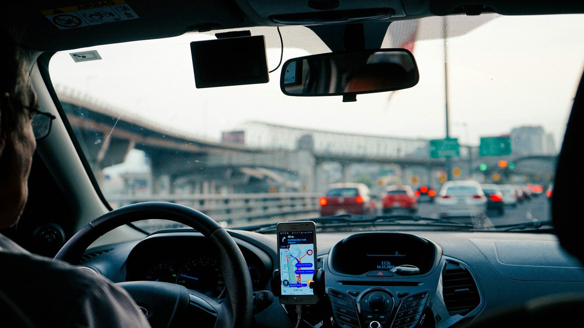 A view from the backseat inside a car-share ride