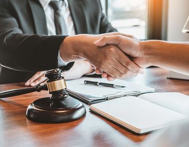 Lawyer And Businessman Shaking Hands — Hartland, WI — Langer & Peterson LLC