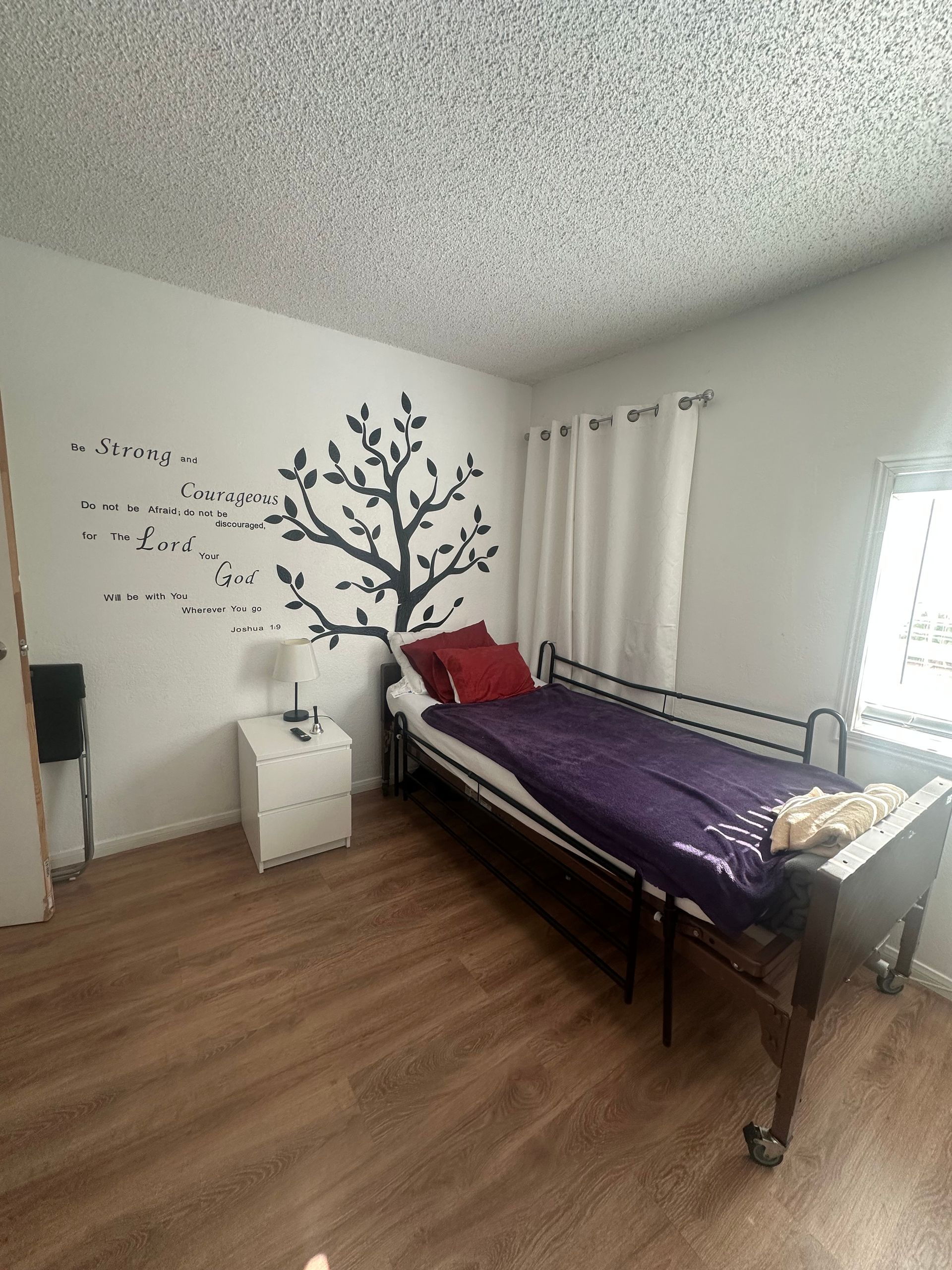 Younger hands gently holding the hands of an older person, showing comfort and support.