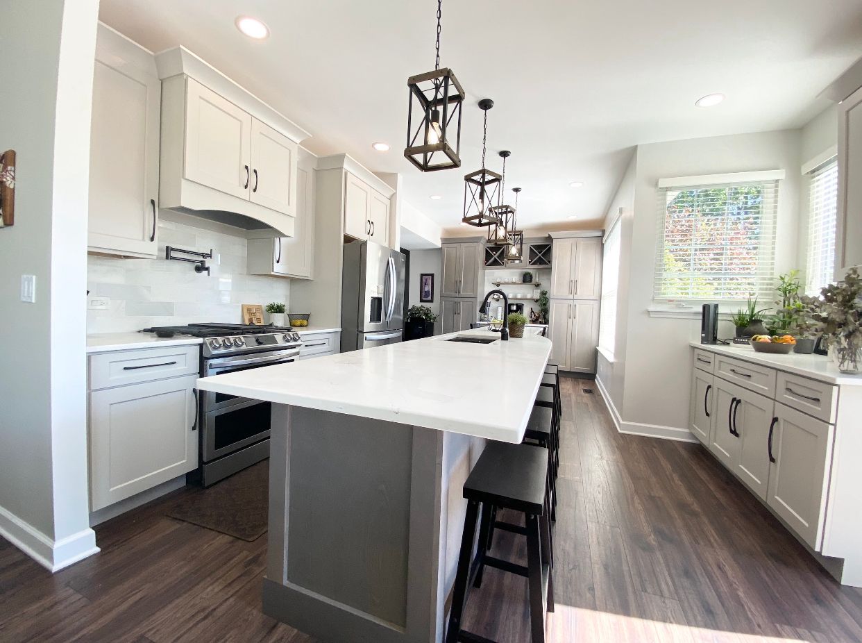 There is a large island in the middle of the kitchen.