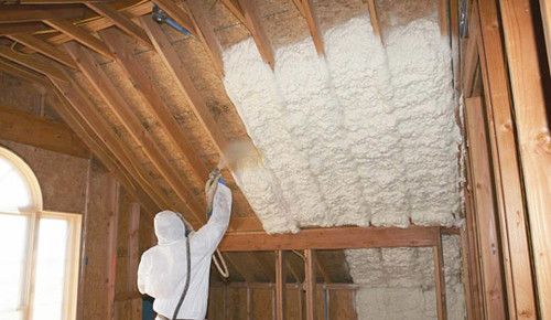 Spray Foam Insulation Contractor spraying foam in Toledo OH attic