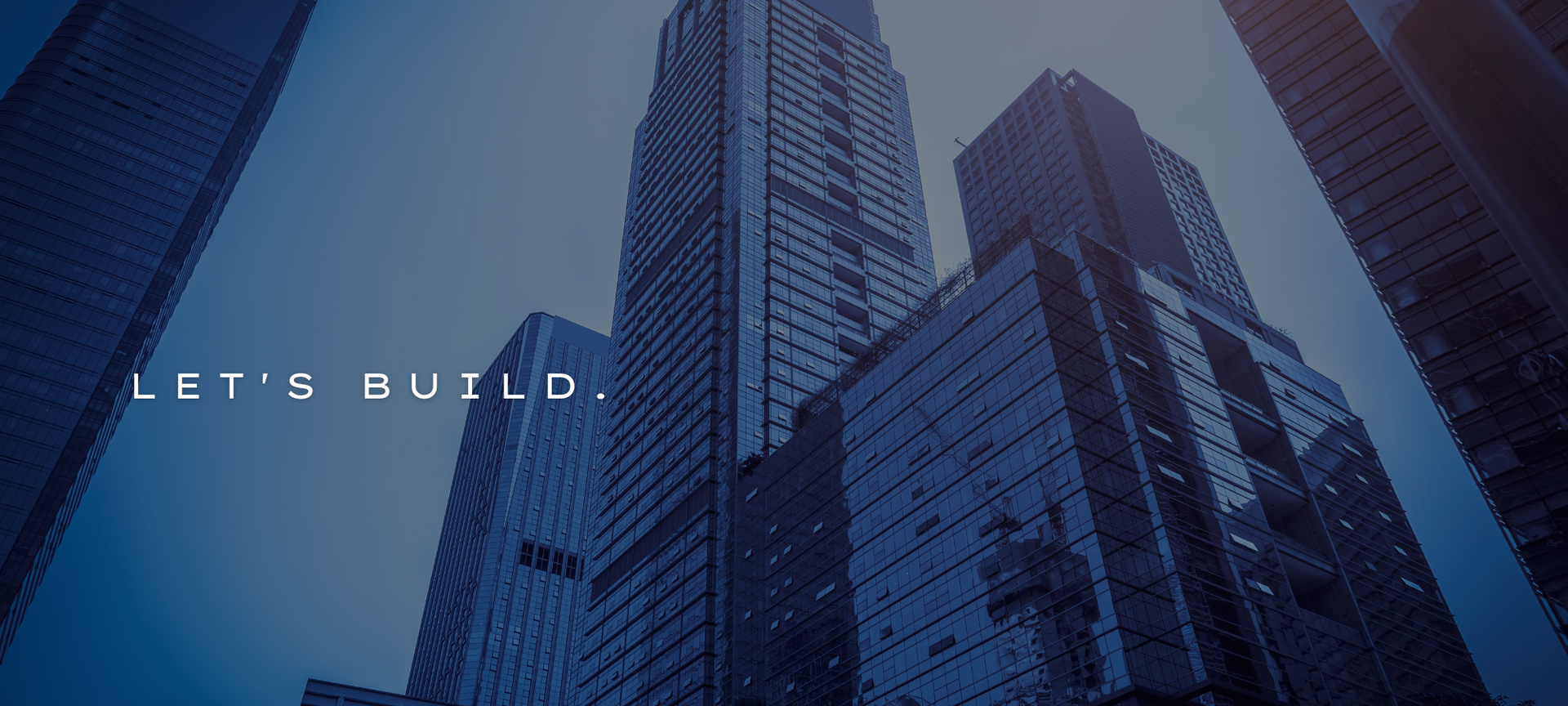 Blue-toned skyscrapers with the text “LET’S BUILD” on the left.