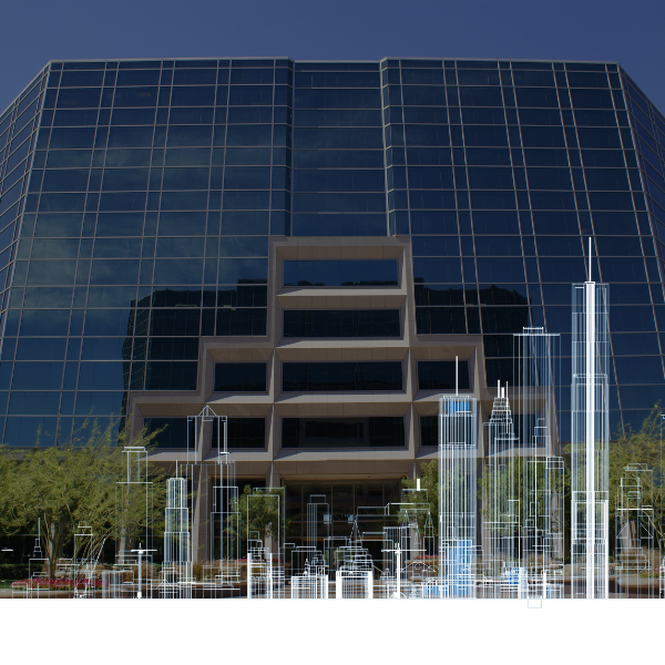 Modern glass office building with reflective blue windows and a fountain in front