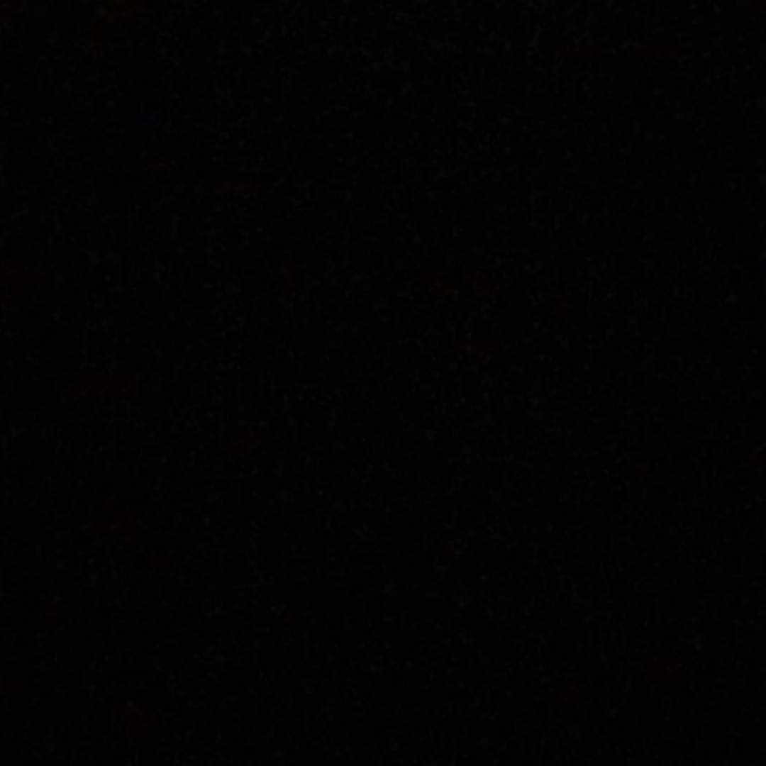 A black background with a few white dots on it