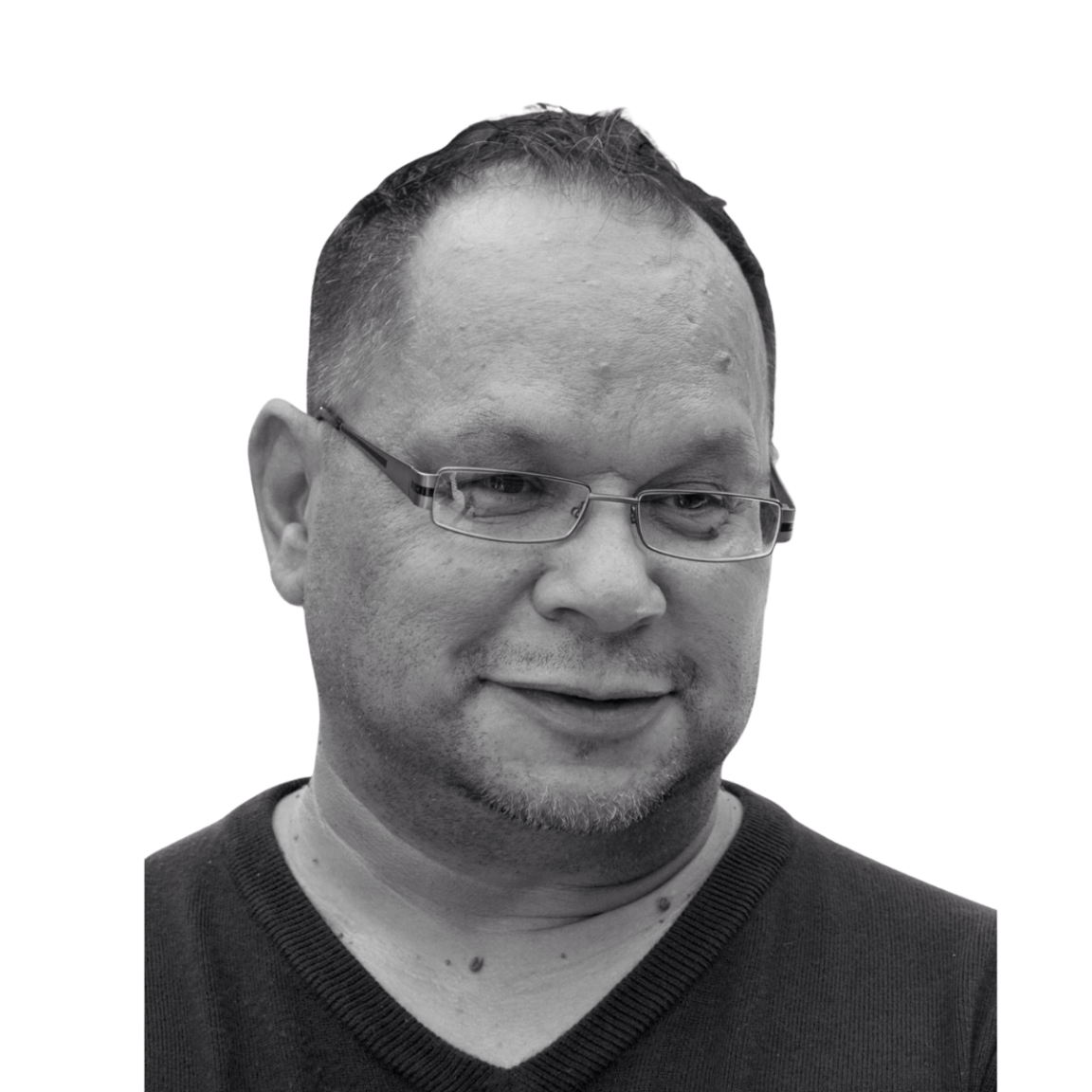 A black and white photo of a man wearing glasses