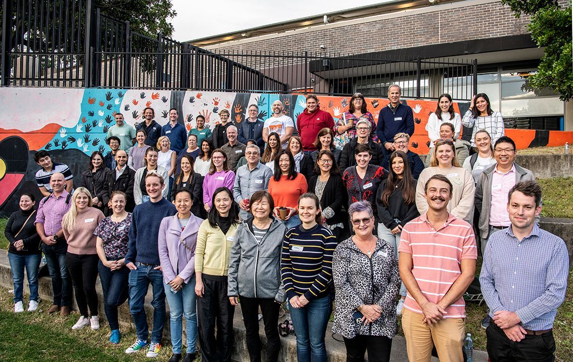 A group of people are dancing on a rooftop.