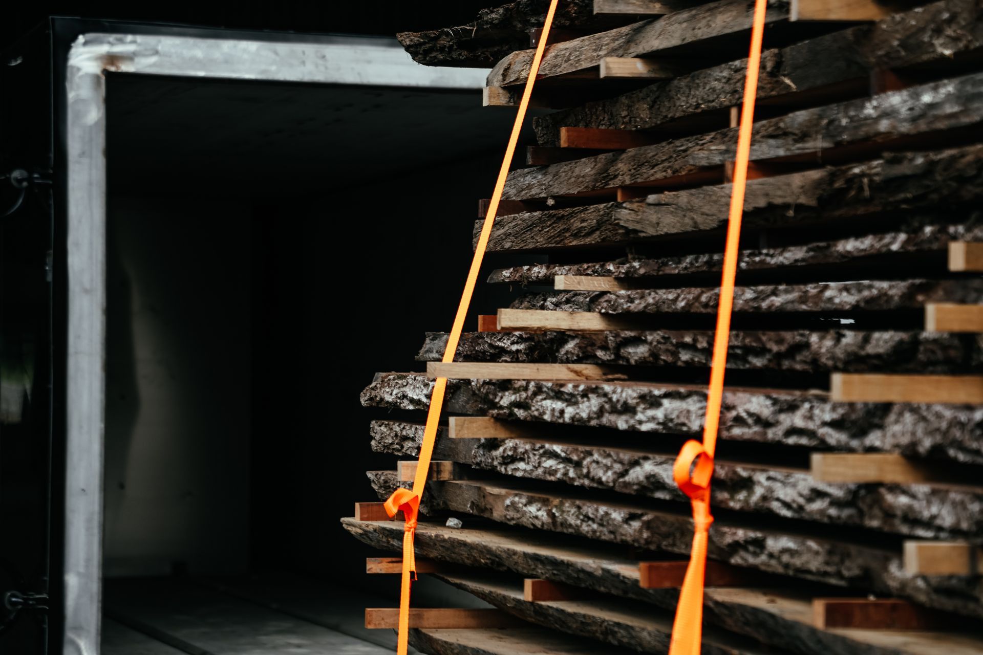 Woodland Hardwoods kiln drying chamber in Columbia Missouri with stacked hardwood slabs inside