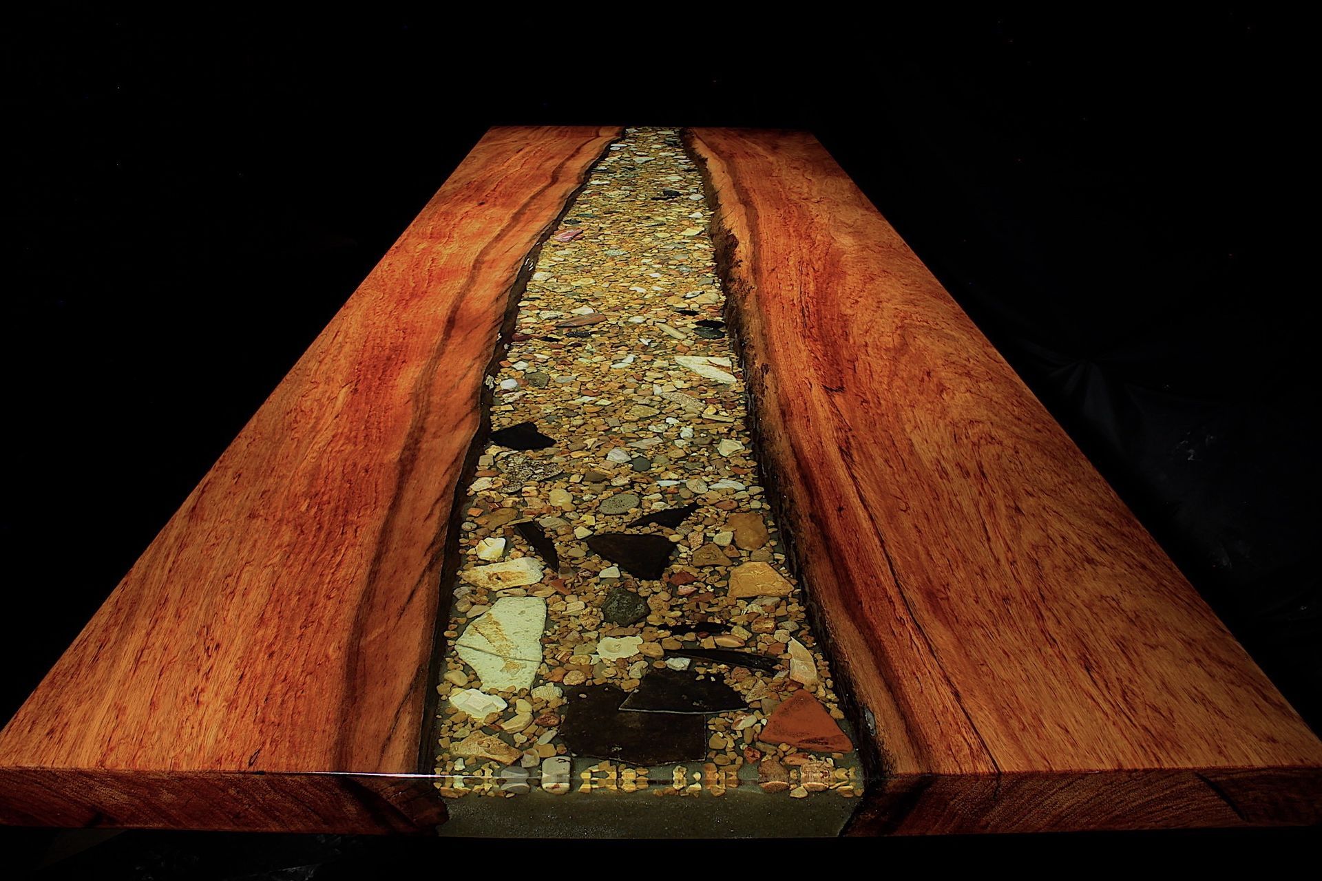A wooden table with a river running through it
