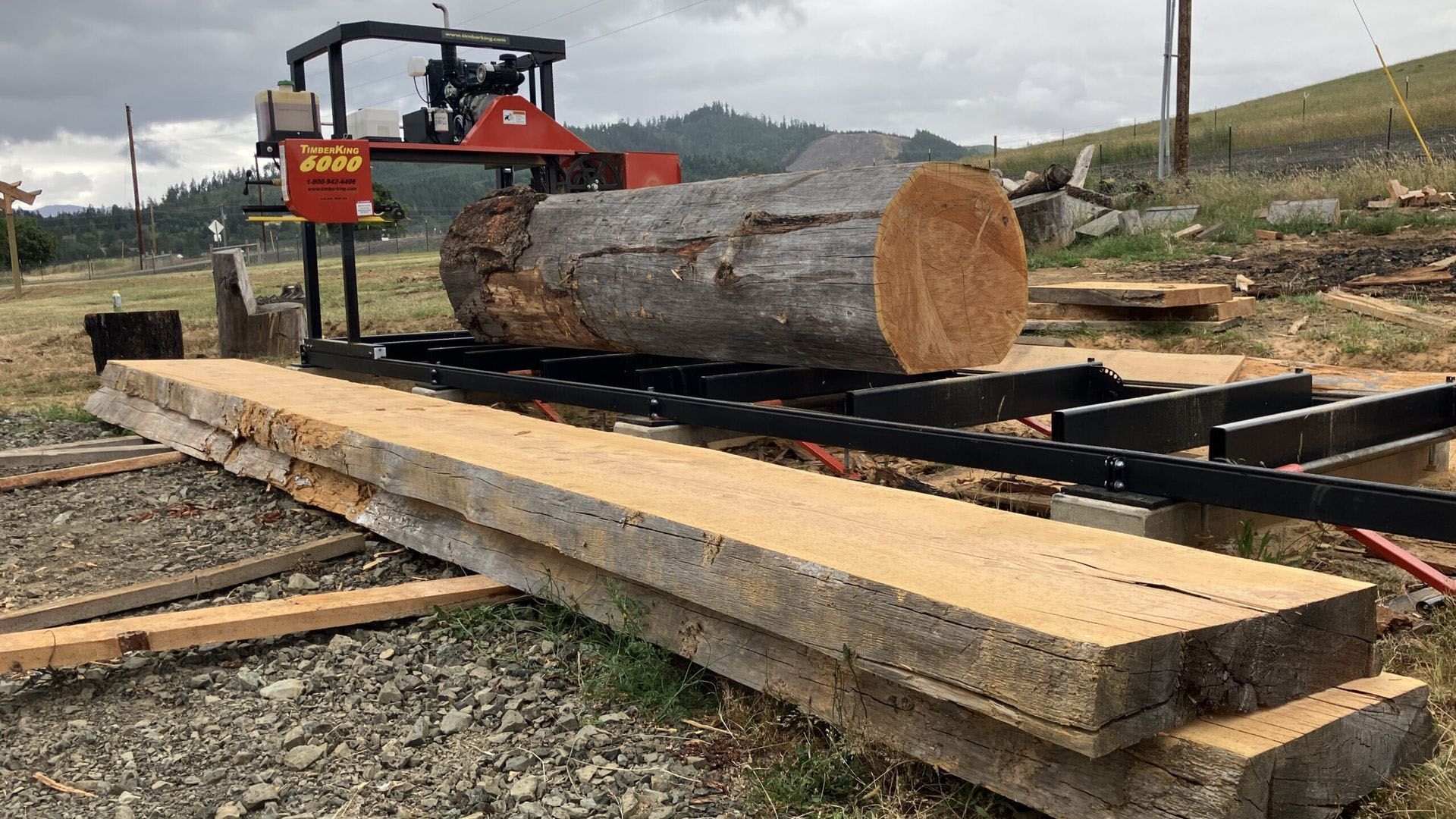 A large log is sitting on top of a sawmill.