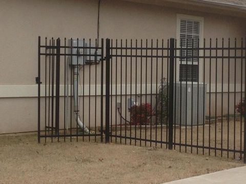 Metal fence in Oklahoma backyard