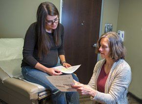 CFM Longmont Nurse-Midwife Ana Williams consults with patient