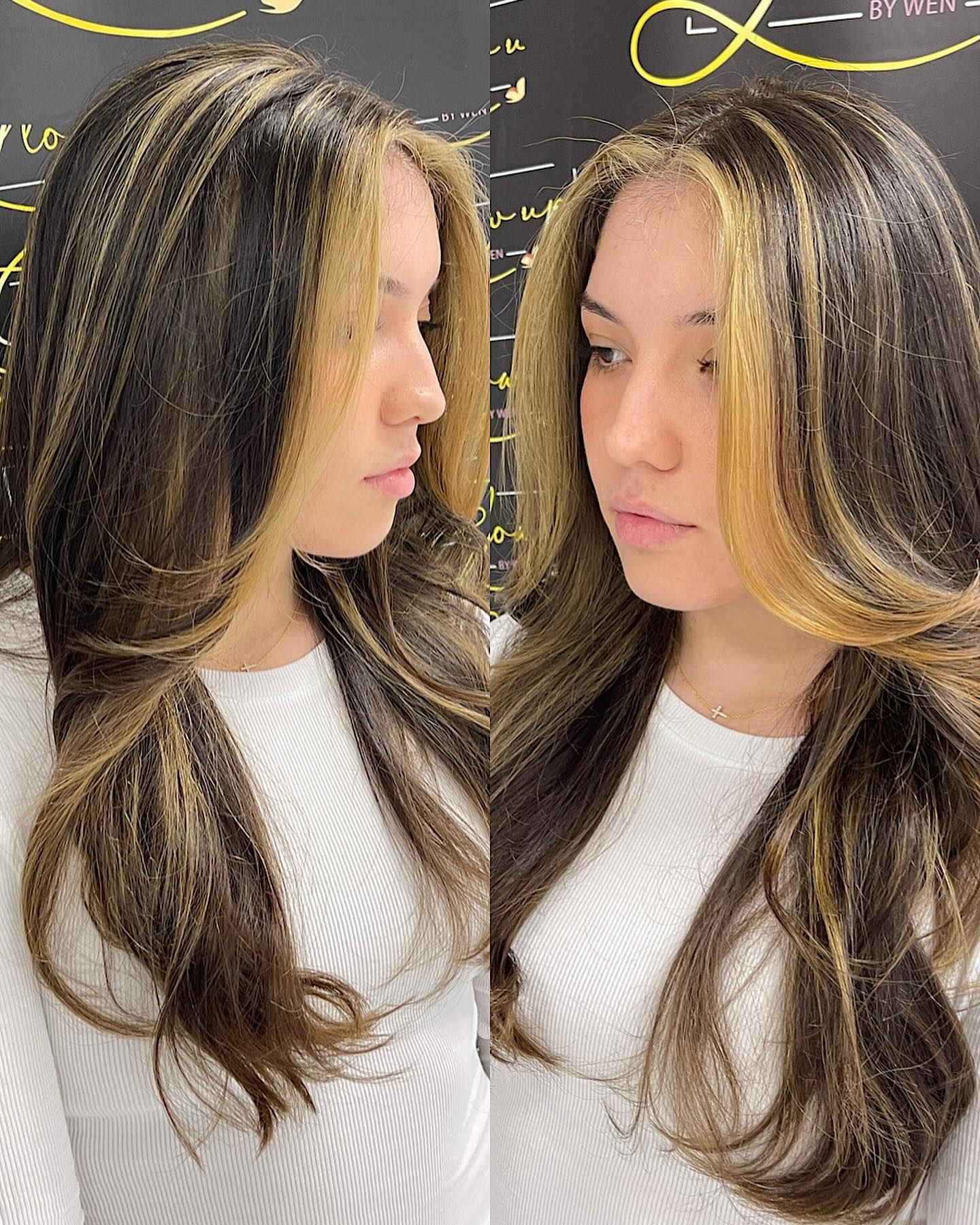 A woman with long hair and blonde highlights is wearing a white shirt.