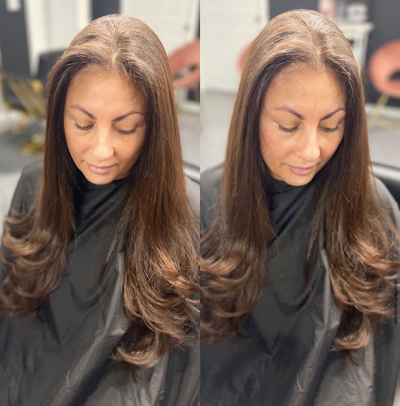 A woman with long brown hair is wearing a black cape