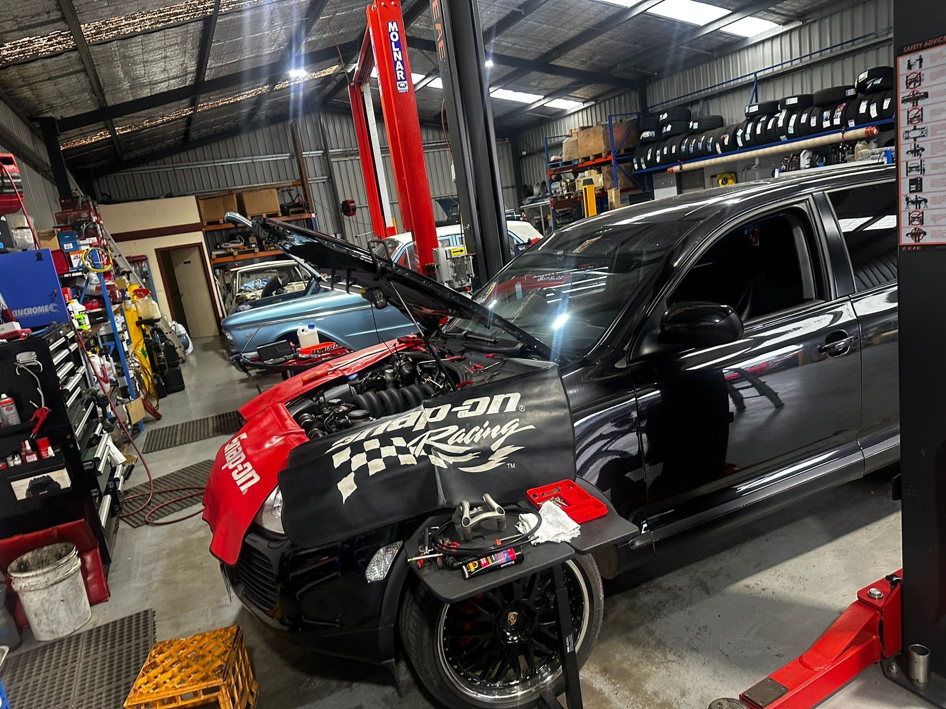 A Black Car With The Hood Open — Marsh Mechanics and Auto Electrical in Maddingley, VIC