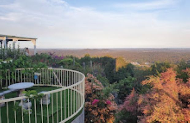 A View of a Valley From a Balcony With a Table and Chairs — Foley's Tanks in Landsborough, QLD