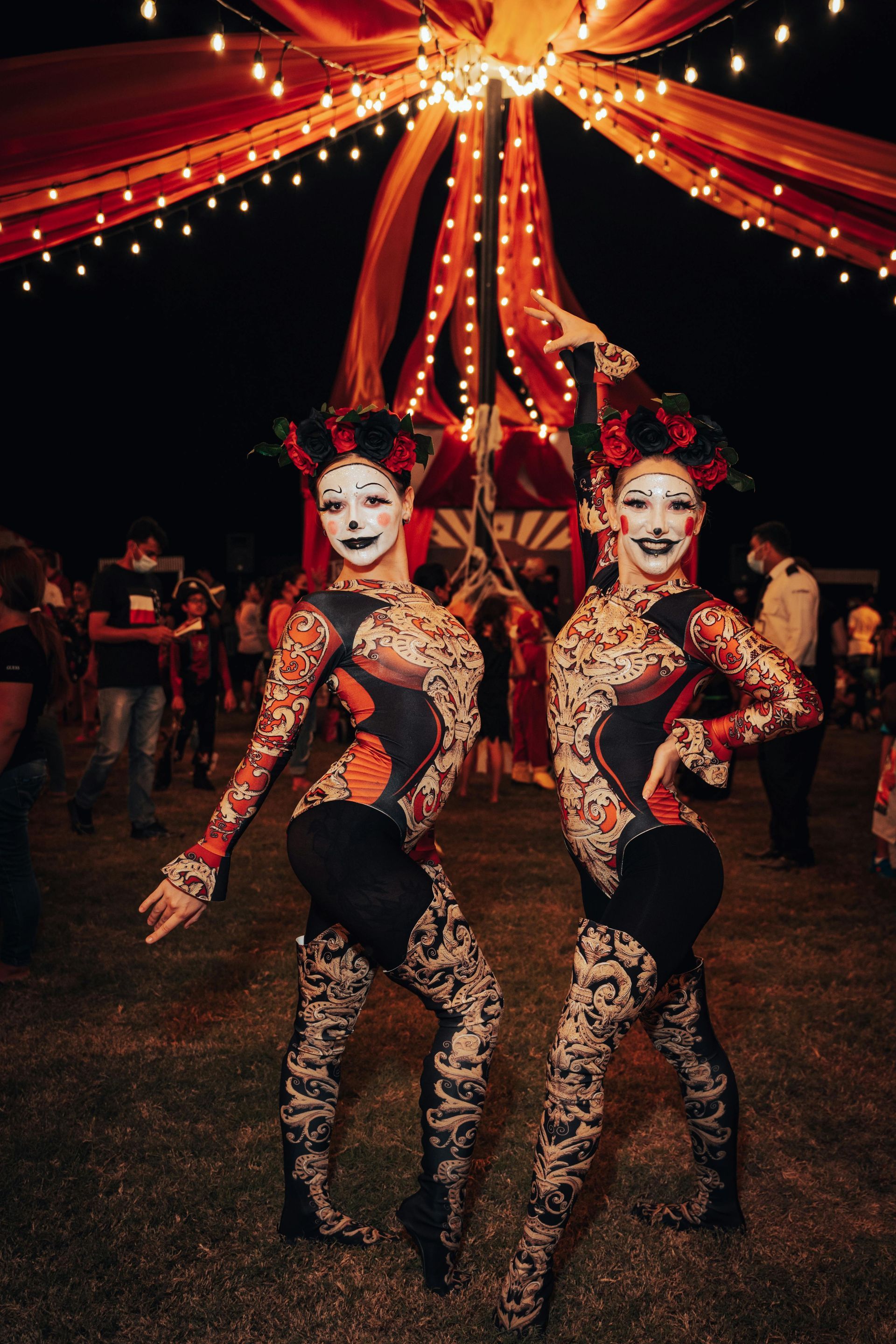 two sexy clowns at a carnival themed party