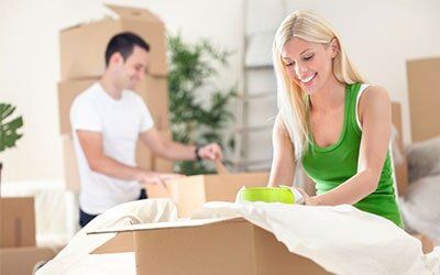 Couple unpacking boxes - Moving Services in Omaha, NE