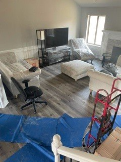 Room filled with furniture and a television