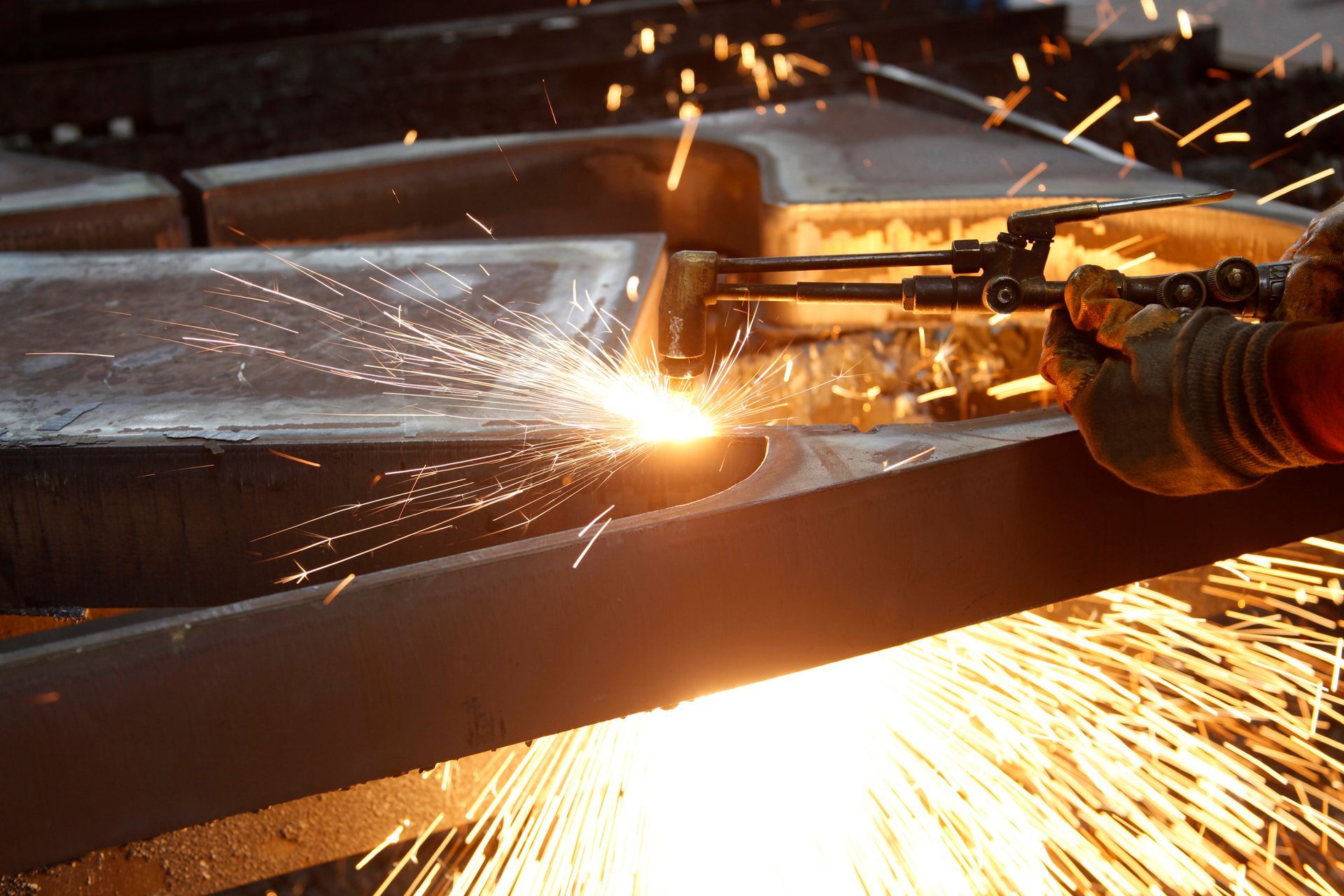 Steel factory welding process by skilled workers, highlighting a trusted steel supplier. Steel factory welding process by skilled workers, highlighting a trusted steel supplier.