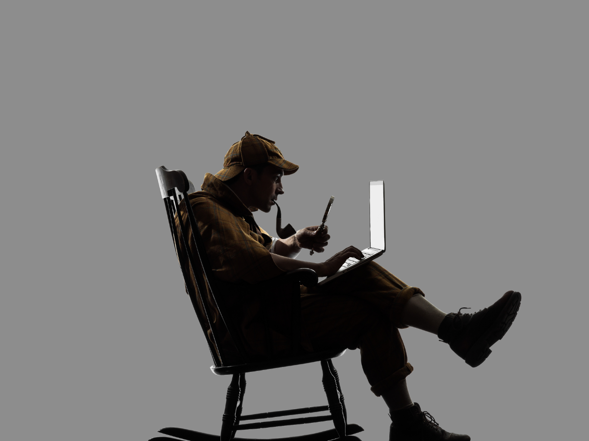 A silhouette of a person in a cap sitting in a rocking chair, smoking a pipe while working on a laptop.