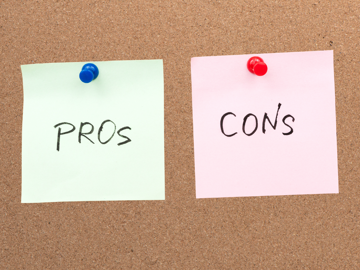 Two sticky notes pinned to a corkboard, one light green labeled 