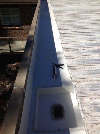 Sealant Being Applied on the Roof — Gutterpro in Coffs Harbour