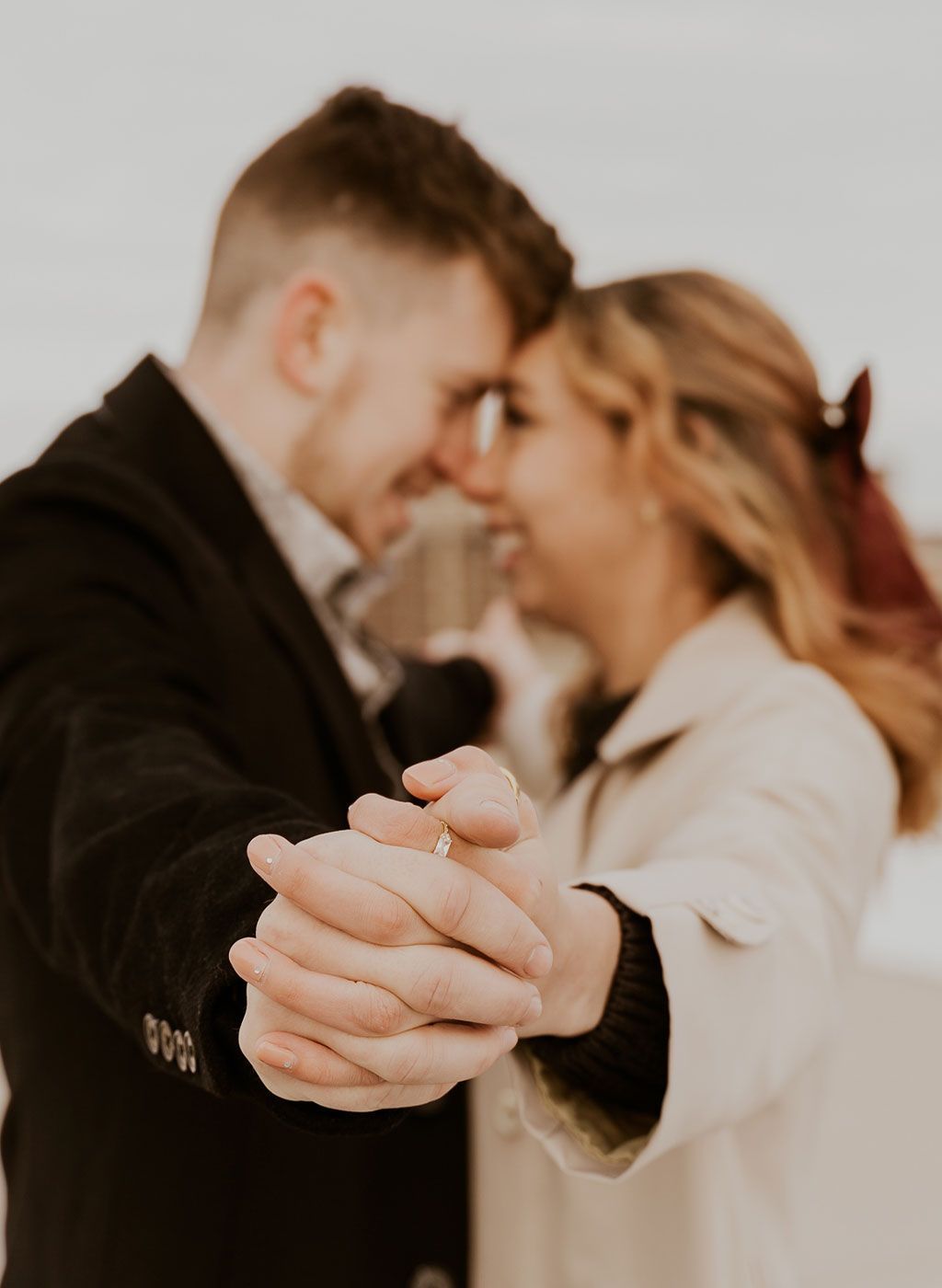 A man and a woman are holding hands and dancing.