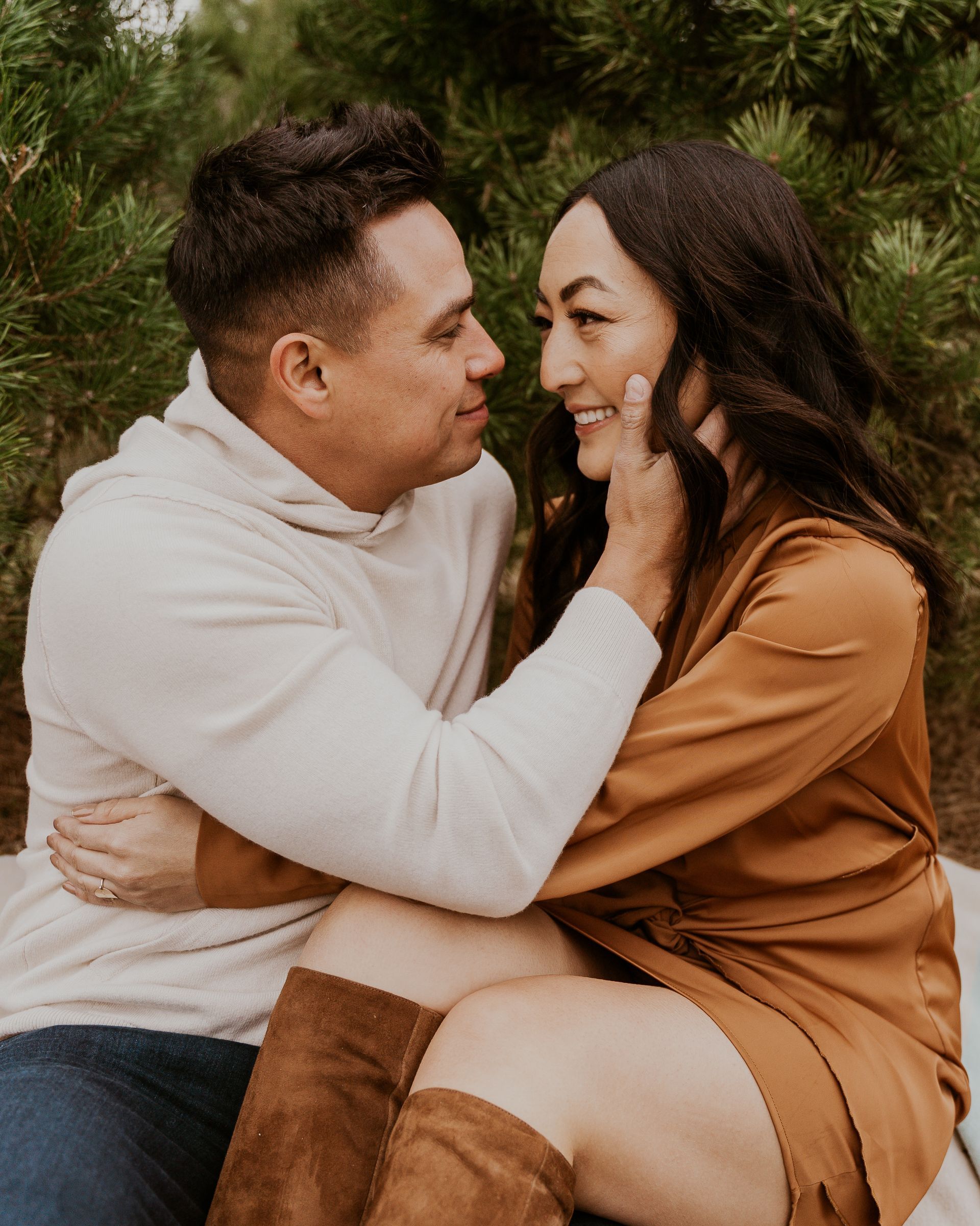 A man and a woman are sitting next to each other and looking at each other.