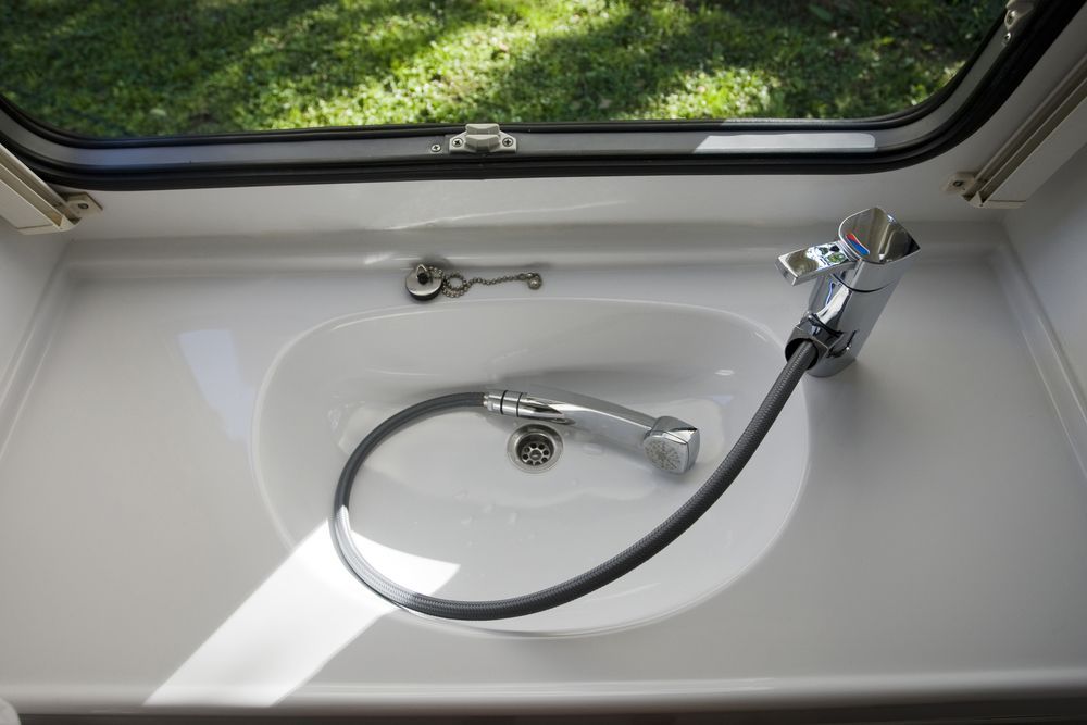 White Sink With a Chrome Faucet — G&S Caravan Services in Taylors Beach, NSW