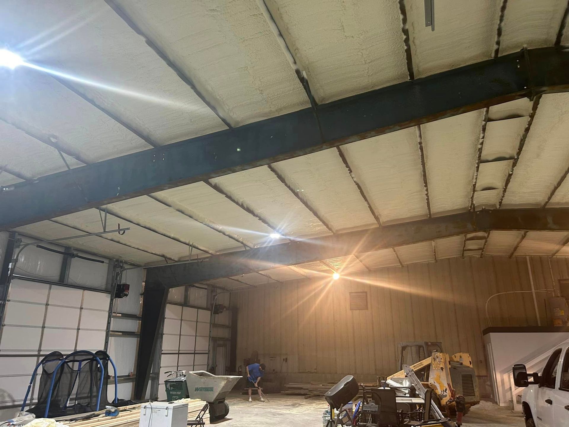 A large warehouse with a lot of machinery inside of it.