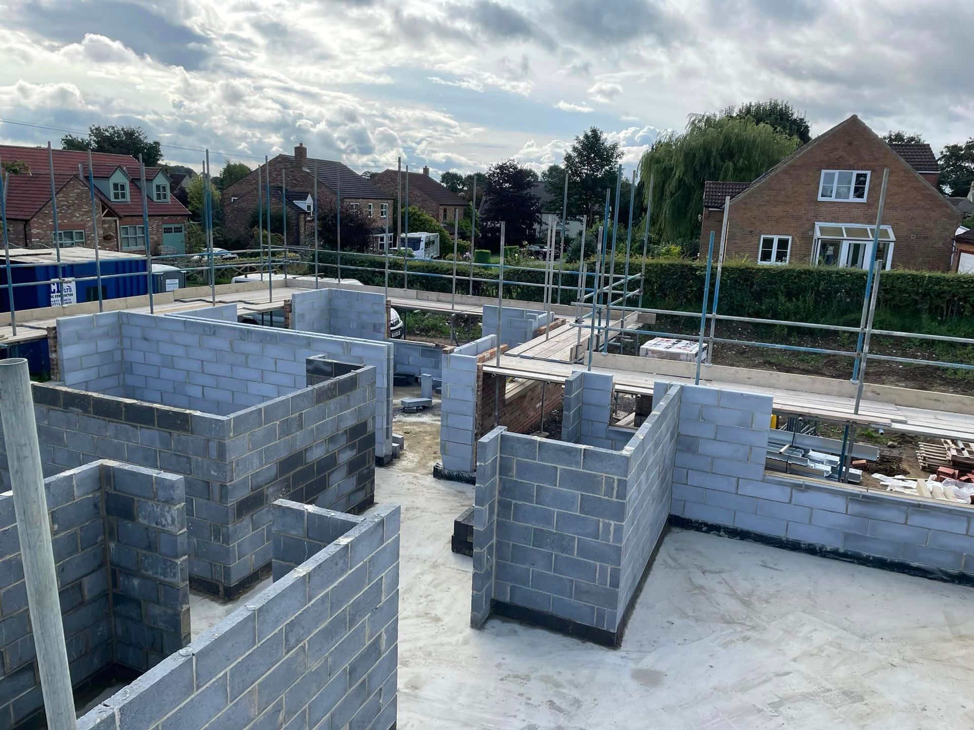 A building under construction with a lot of bricks and scaffolding.