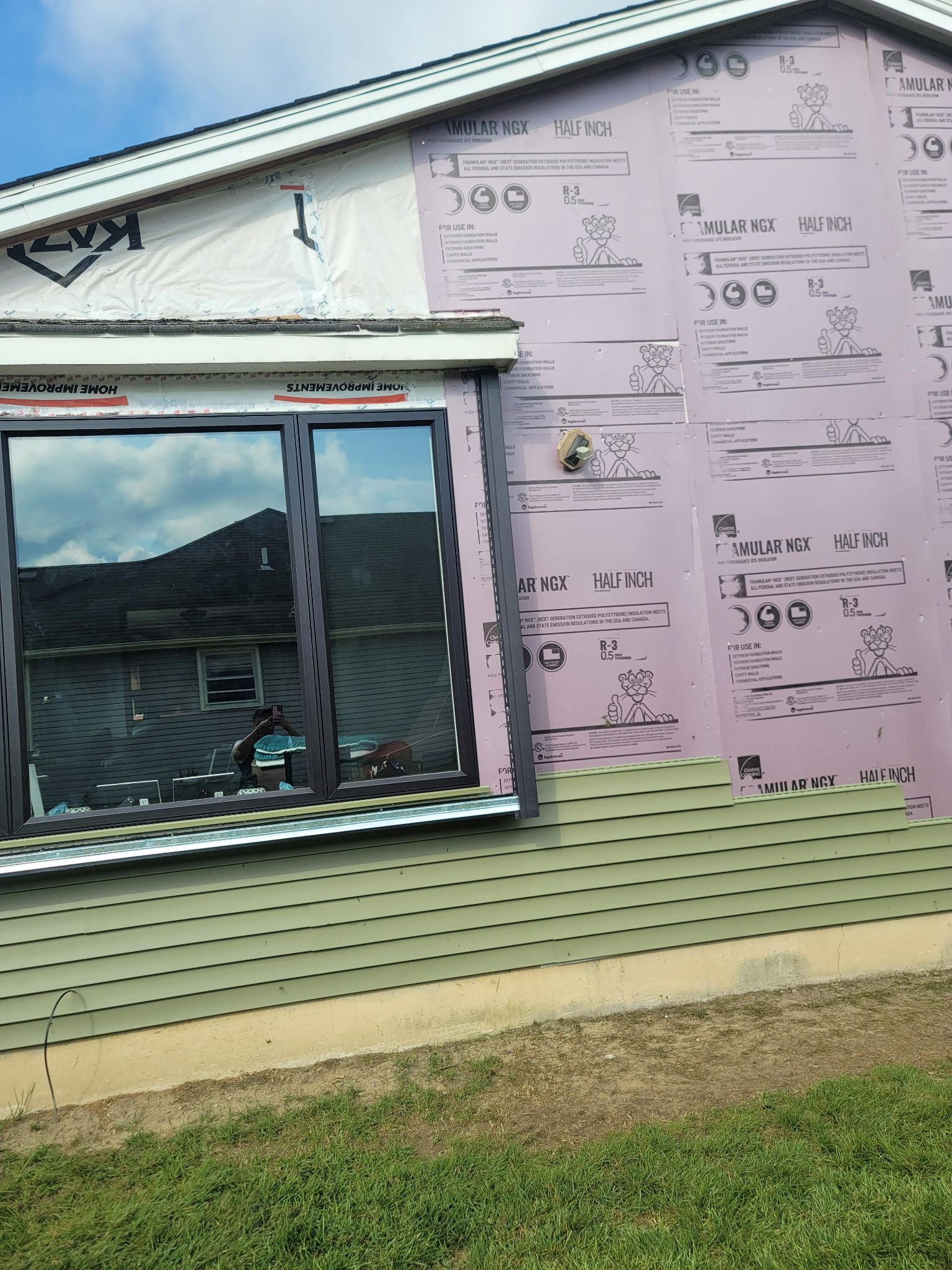 Interior under construction, drywall installed, doorway frames visible. Unfinished, empty rooms with windows.