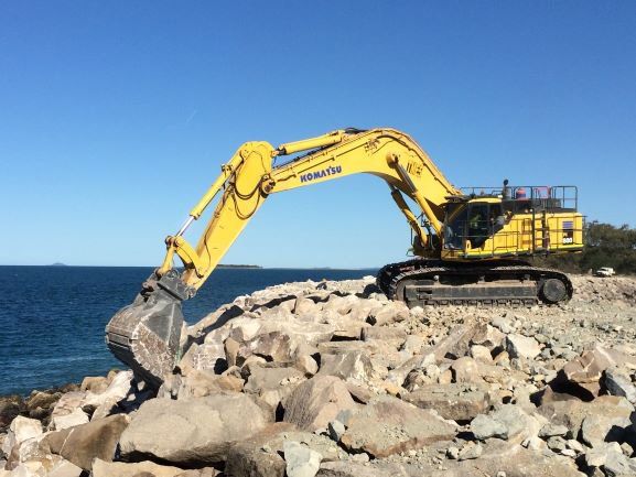 Excavator Besides The Coast — Earthmoving & Quarry Supplies In Mackay, QLD
