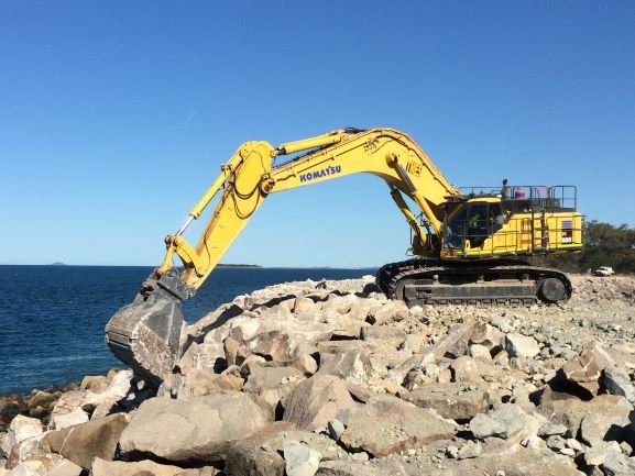 Excavator Besides The Coast — Earthmoving & Quarry Supplies In Mackay, QLD