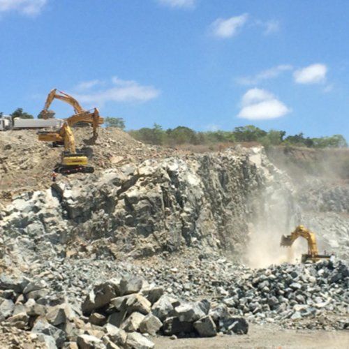 Excavators Digging Rocks — Earthmoving & Quarry Supplies In Mackay, QLD