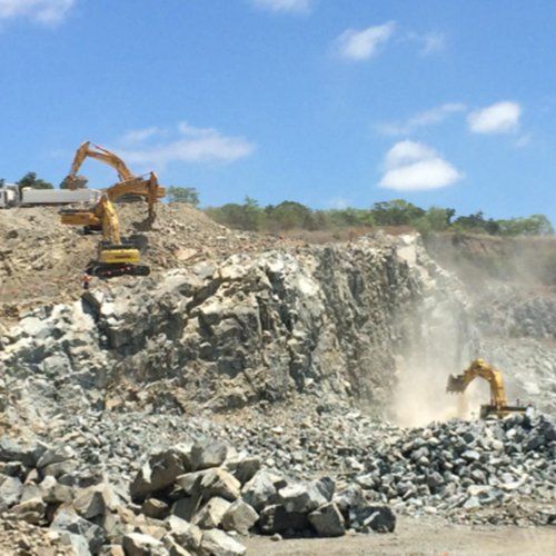 Excavators Digging Rocks — Earthmoving & Quarry Supplies In Mackay, QLD