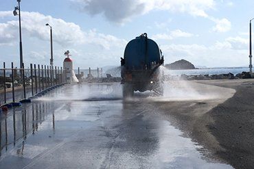 Water Spraying Out Of Trucks — Earthmoving & Quarry Supplies In Mackay, QLD